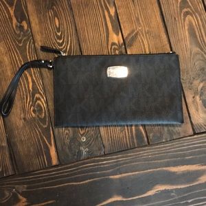New black Michael kors wristlet. Never used.
